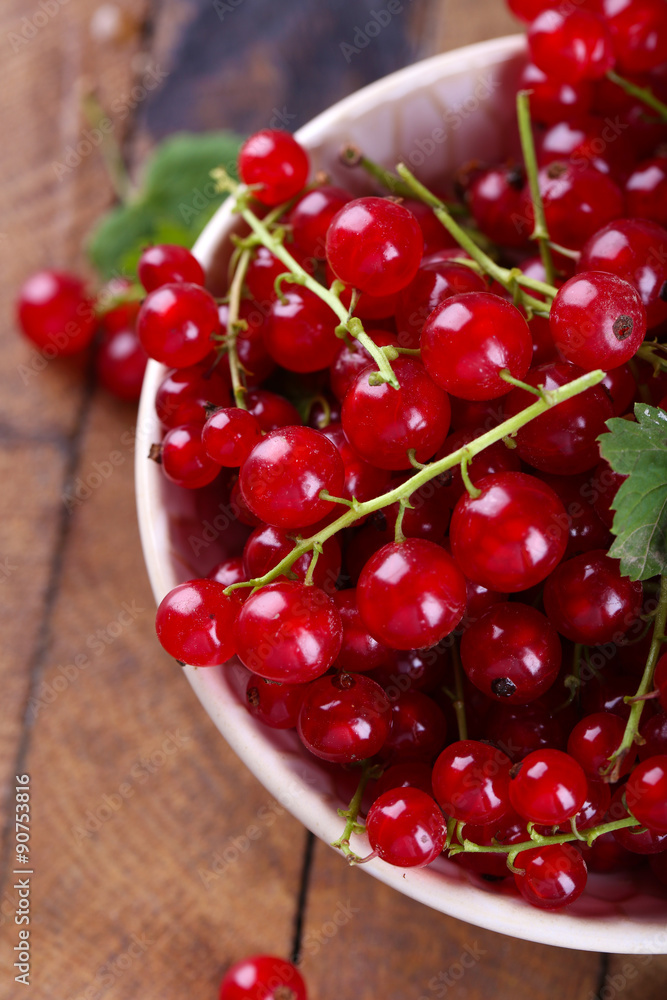 Fresh red currants in bowl close up Fresh red currants in bowl close up