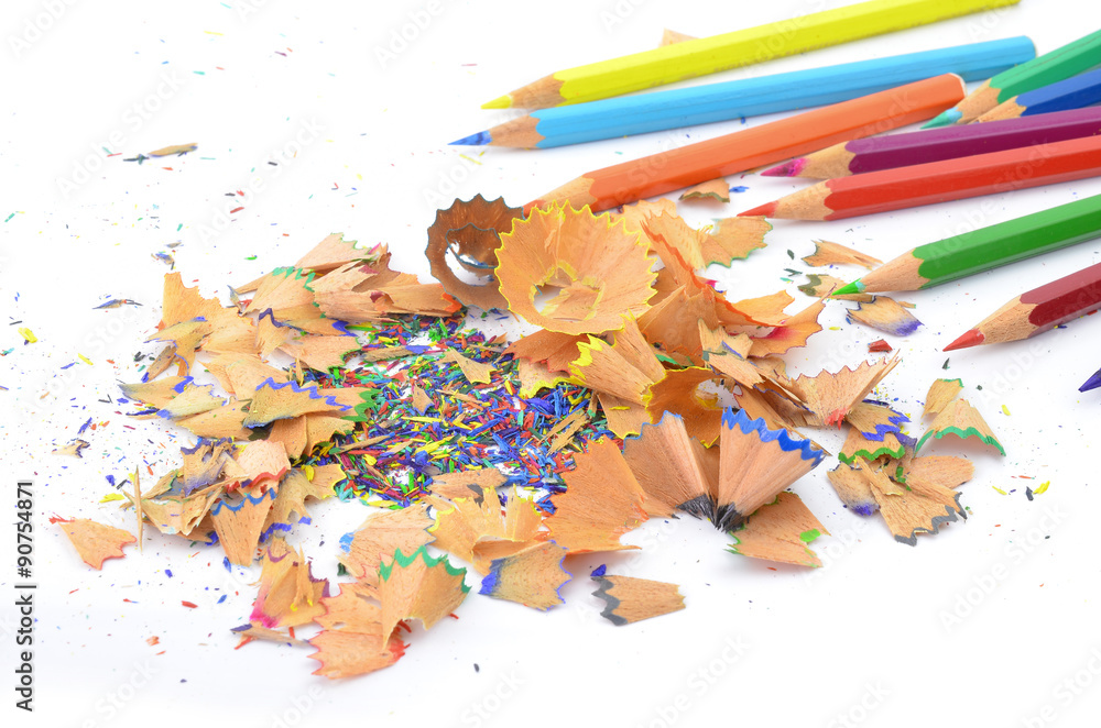 Shavings from multicolored pencils on white background Shavings from multicolored pencils on white background