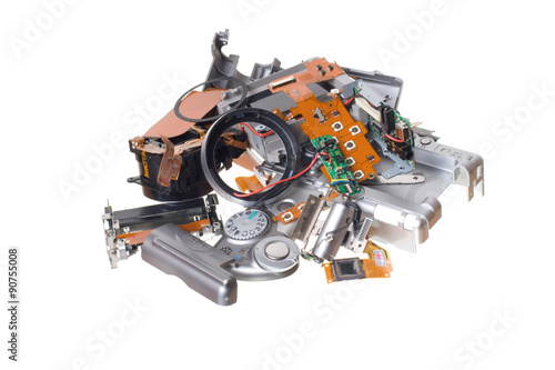 Disassembled broken compact digital camera spare parts isolated on white