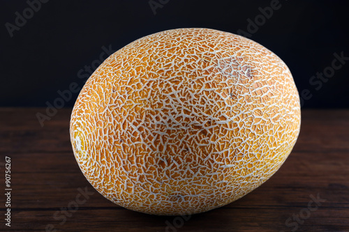 Ripe melon on dark background