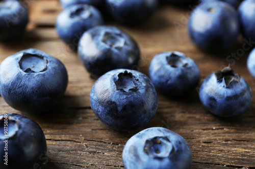 Fresh blueberries on wooden table, closeup