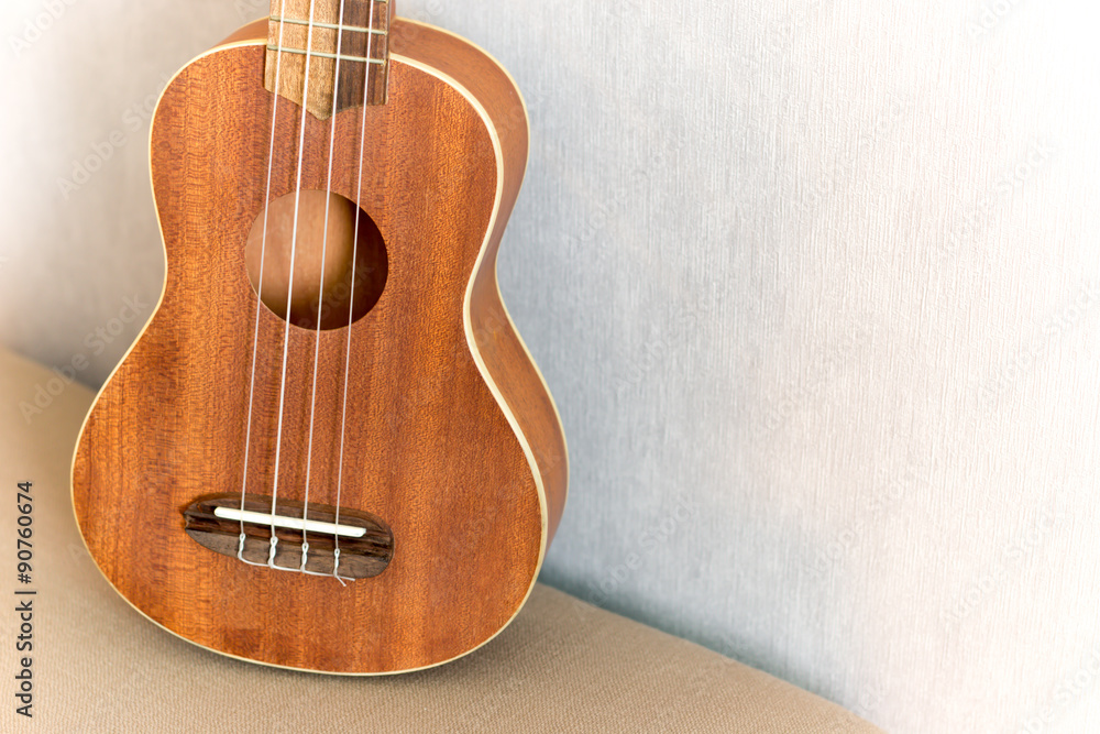 Obraz premium Close up of ukulele with soft light, Vintage tone