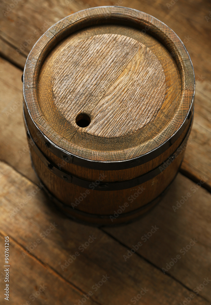 Fototapeta premium Old wine barrel on wooden background