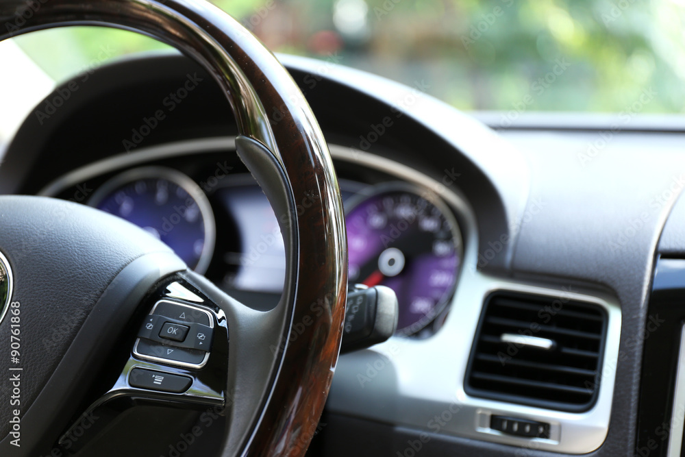 Modern car illuminated dashboard and steering wheel