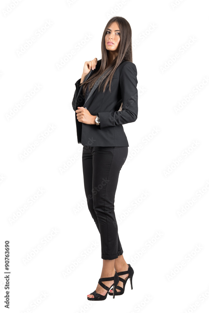 Gorgeous business beauty in black jacket and pants posing at camera. Gorgeous business beauty in black jacket and pants posing at camera.
