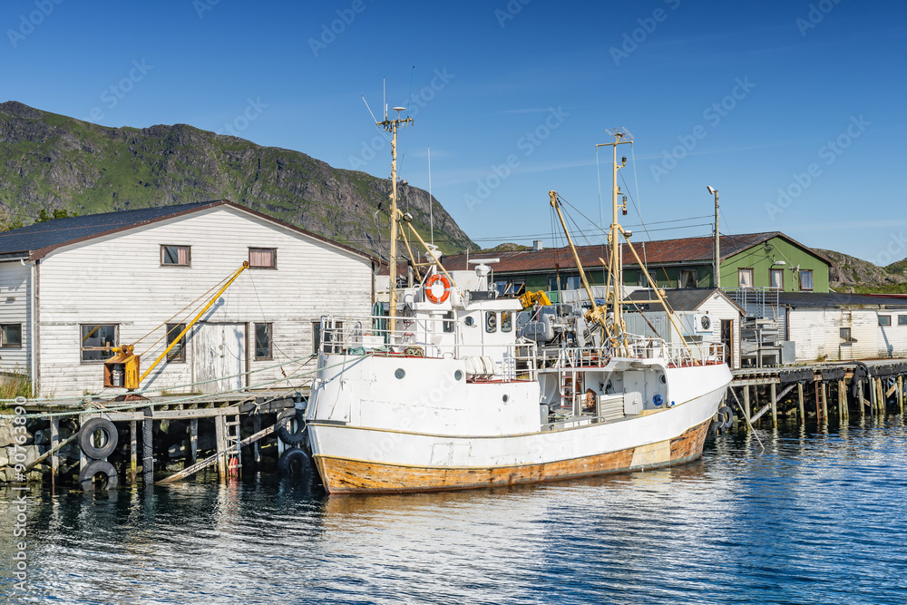 Fishing boat moored in the fishing port. Lofoten arcghipelago.