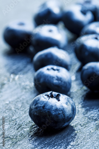 Fresh ripe blueberries on a dark background, selective focus