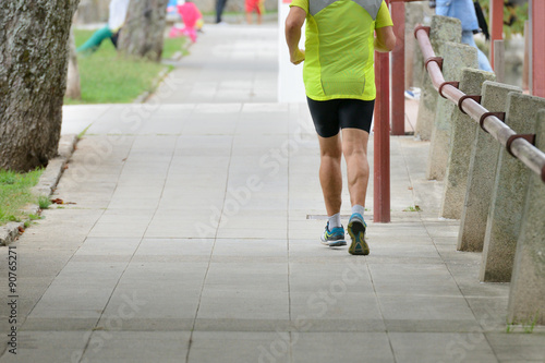 man jogging on urban alley