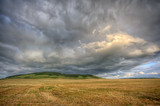 Stormy cloudscape over the summer field