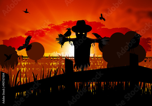 autumn scarecrow guarding the field from the crows Halloween