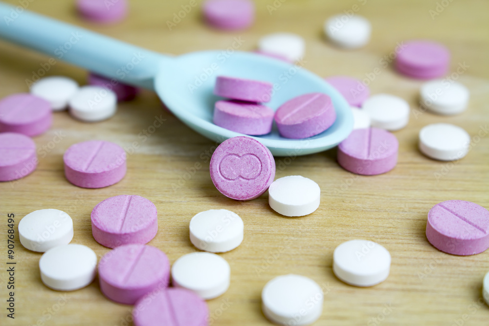 group of drugs on a spoon and wooden board group of drugs on a spoon and wooden board