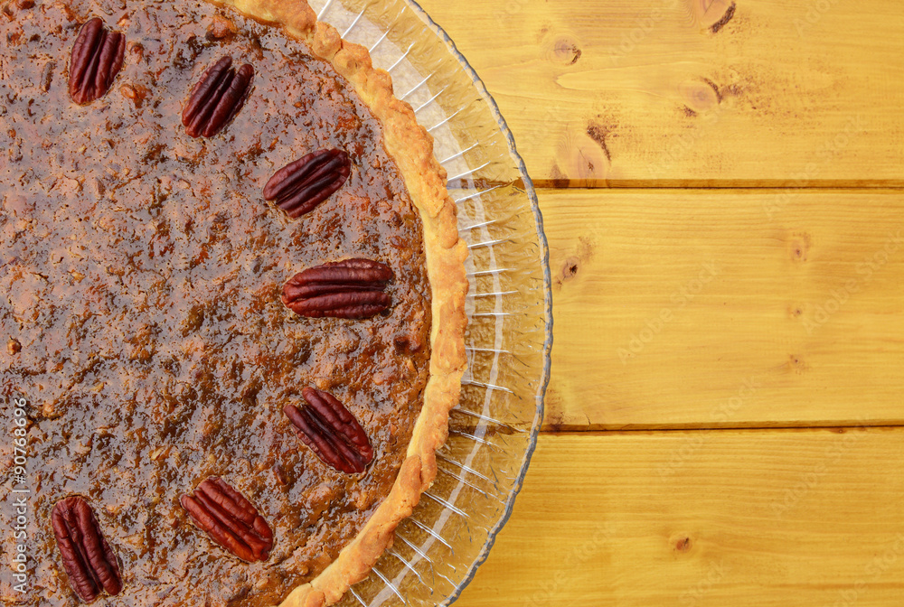 Half pecan pie served on a glass plate Half pecan pie served on a glass plate