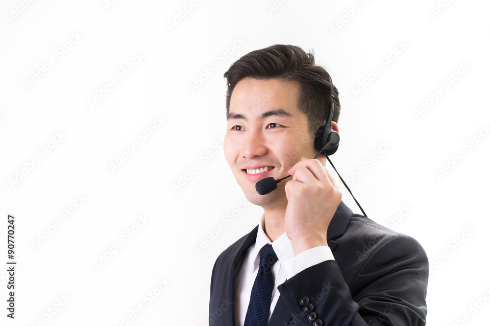 Businessman talking using headset, white background Businessman talking using headset, white background