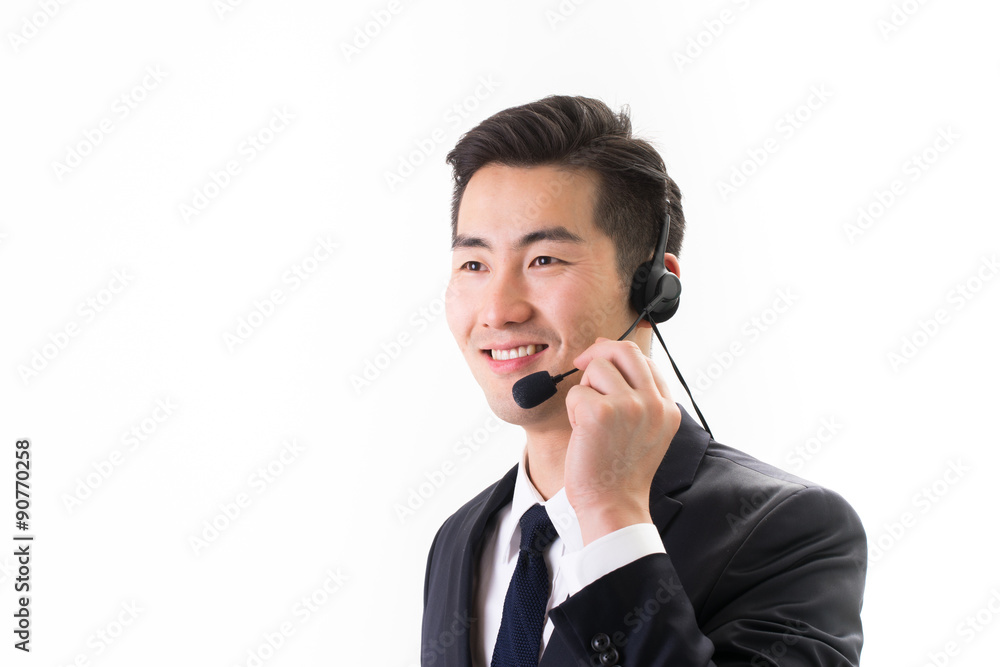 Businessman talking using headset, white background Businessman talking using headset, white background