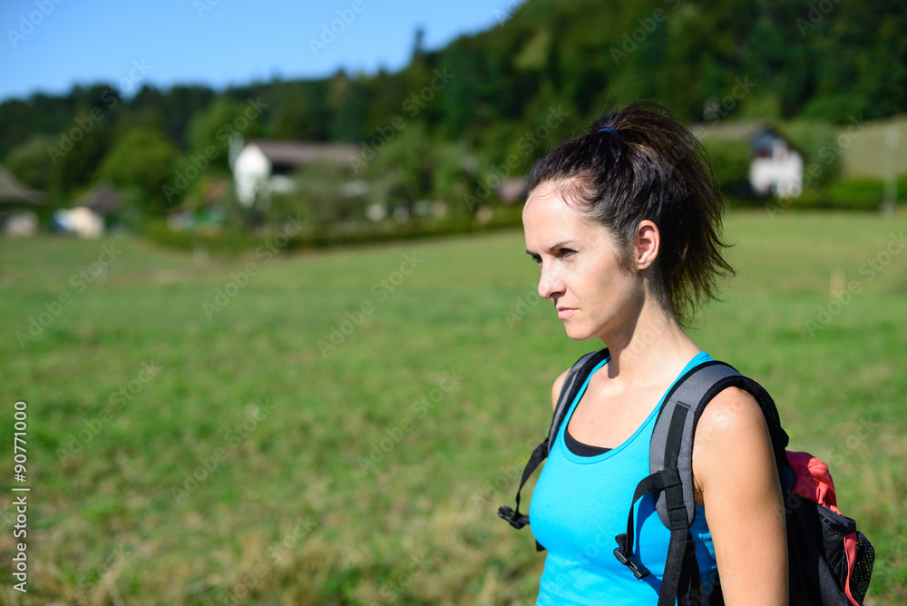 Beautiful young woman is hiking in a sunny summer day Beautiful young woman is hiking in a sunny summer day
