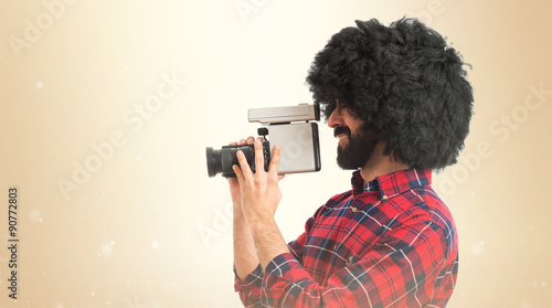 Afro man filming