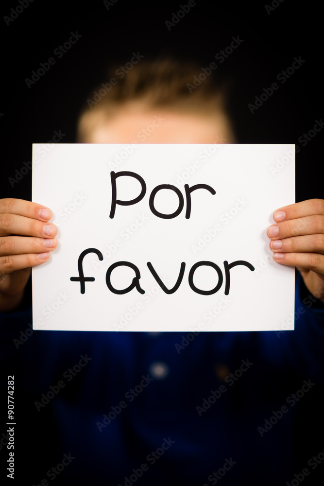Child holding sign with Spanish words Por Favor - Please Child holding sign with Spanish words Por Favor - Please