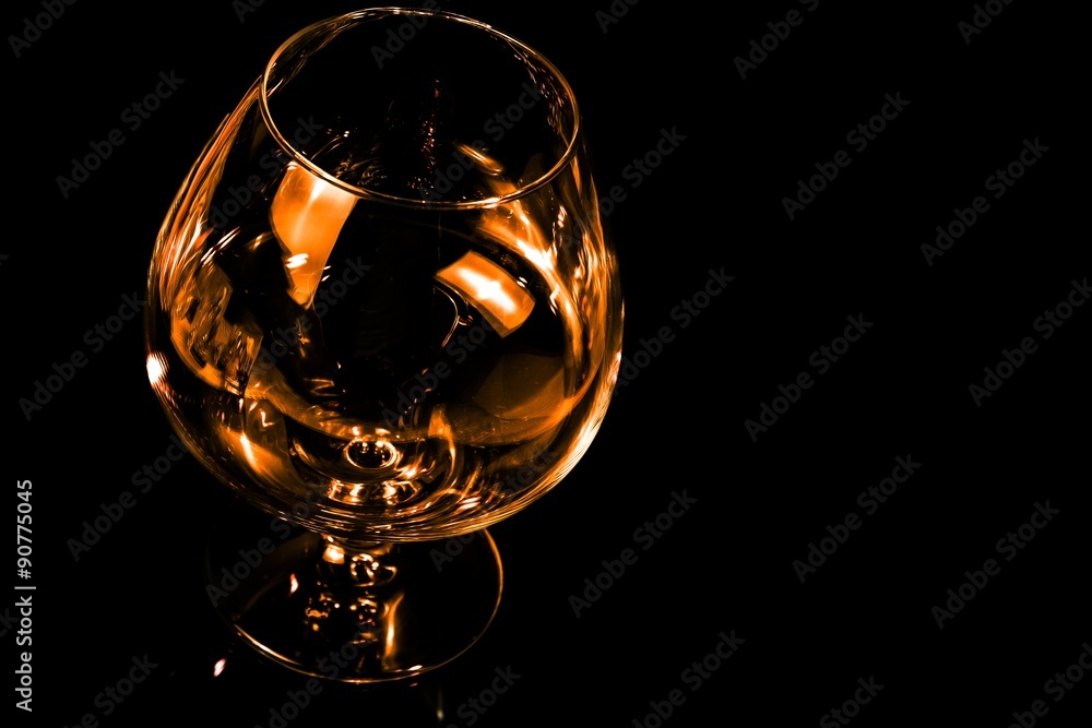empty snifter of brandy in elegant typical cognac glass on black background  Stock Photo | Adobe Stock