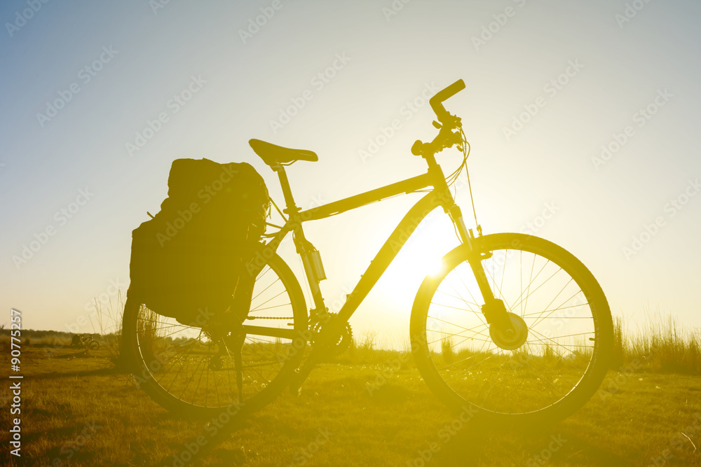 Obraz premium bicycle silhouette on a sunset background