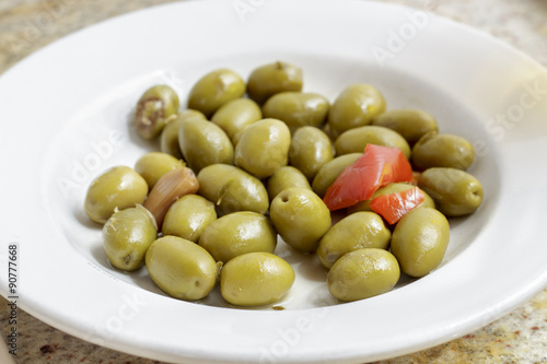 Dish of green olives of sevillian type