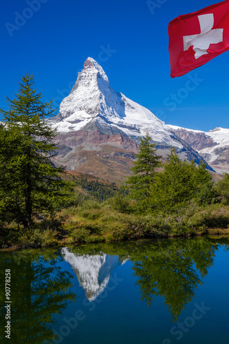 Matterhorn reflecting in Grindjisee in Swiss Alps, Switzerland photo