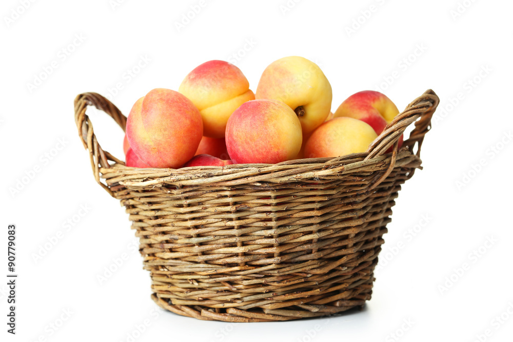 Fresh apricots in basket on a white background Fresh apricots in basket on a white background
