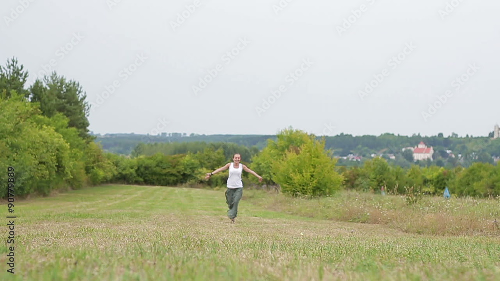 Young woman running on the meadow, slow motion
Young woman running on the meadow, slow motion