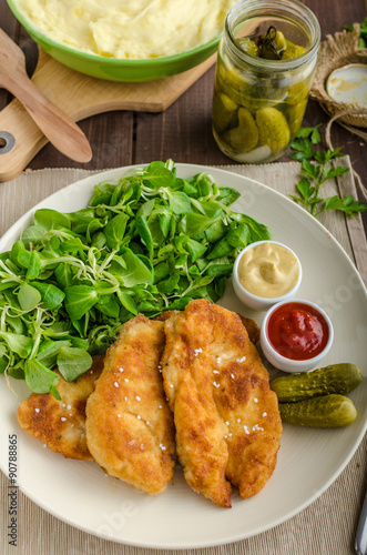 Schnitzel with mashed potatoes and salad