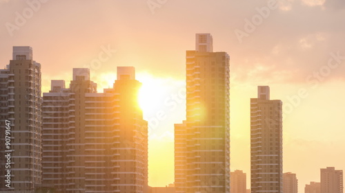 Sunset behind the city buildings photo