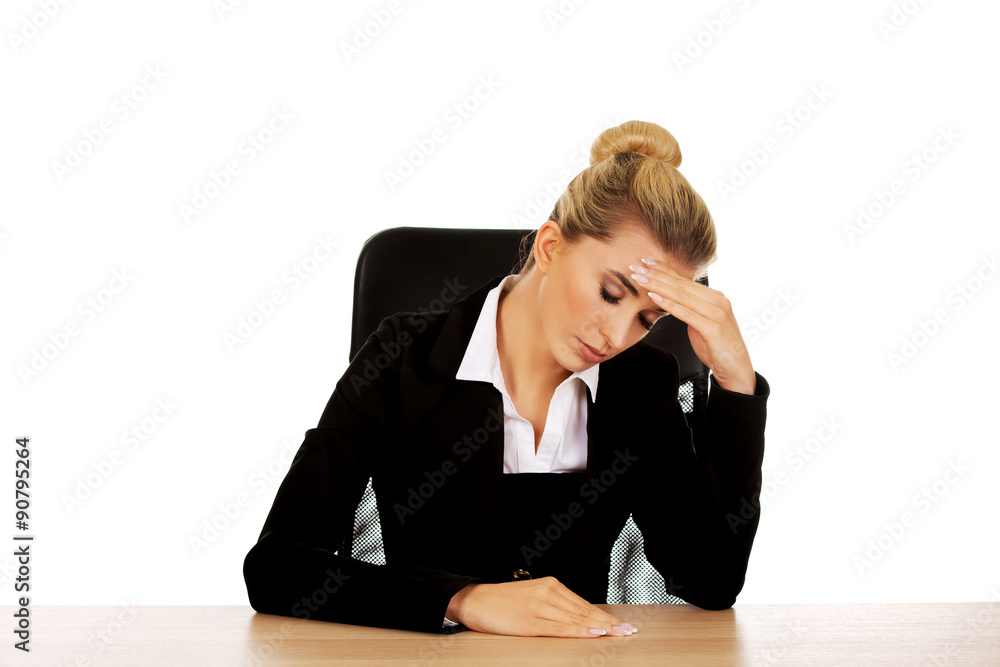 Beautiful worried businesswoman behind the desk Beautiful worried businesswoman behind the desk