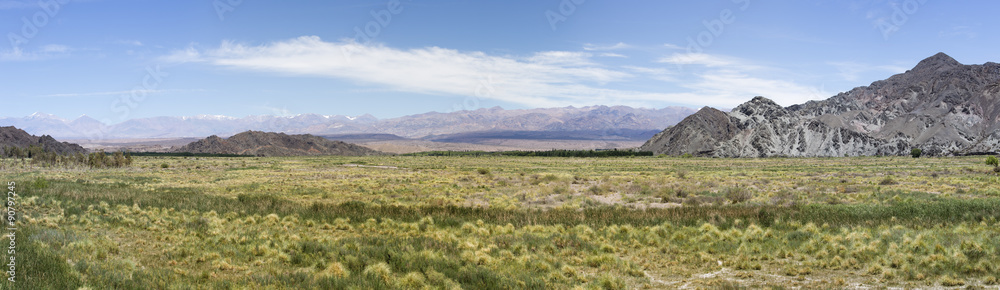 Panorama of mountains, arid wild landscape and blue sky on the famous Ruta 40 (Route 40), within Calchaqui Valleys in Salta Province. Argentina