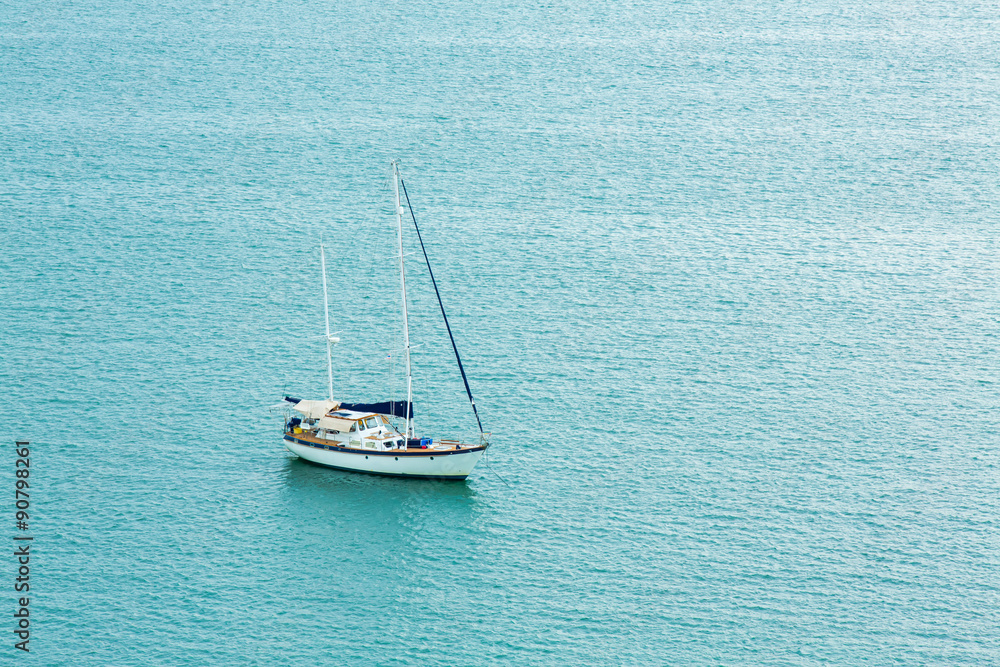 One alone boat in blue sea. One alone boat in blue sea.