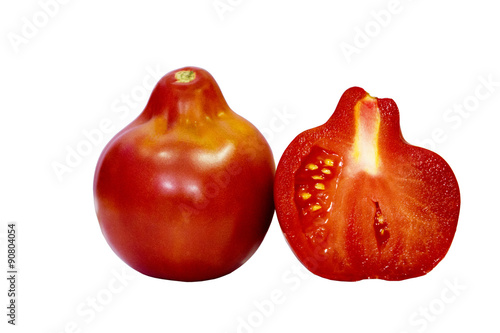 Tomato isolated on white background with clipping path. Closeup with no shadows. Macro. Eating vegetarian. The pear-shaped. One tomato and half a tomato. 