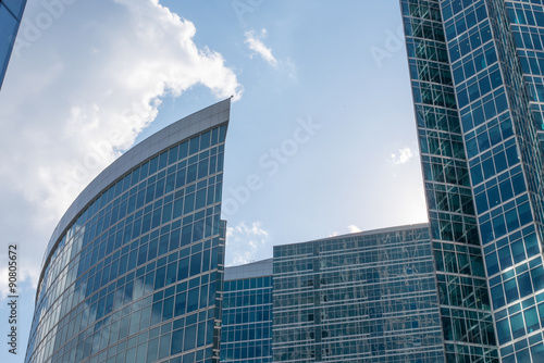 High-rise buildings on blue sky with clouds