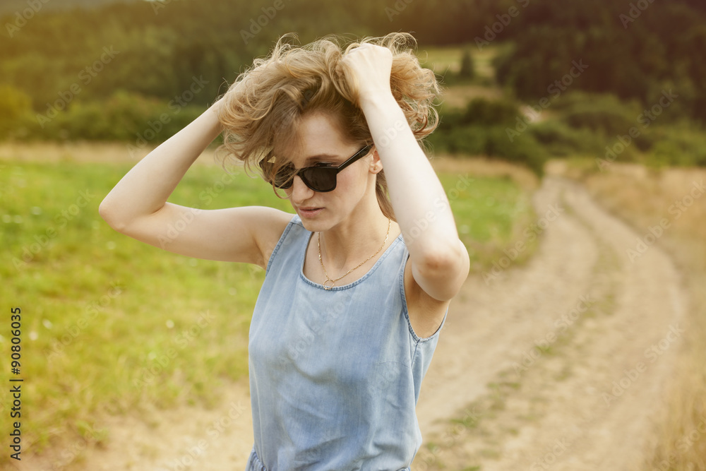 beautiful young woman posing on a meadow. Summer fashion photo. Lifestyle