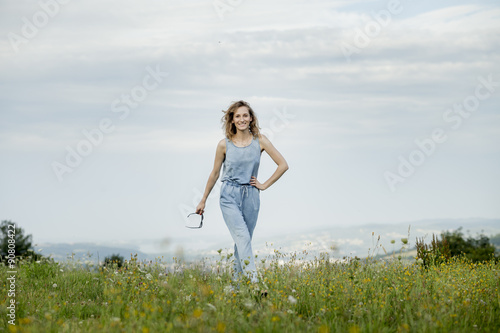 beautiful young woman posing on a meadow. Summer fashion photo. Lifestyle