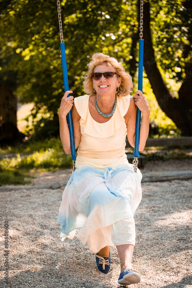 Senior woman on swing portrait Senior woman on swing portrait