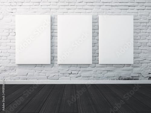 Fototapet Three poster hanging on the wall in the interior. mock up