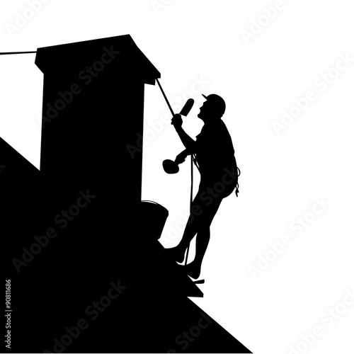 Worker on the house roof