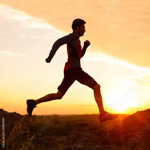 Wallpaper Mural Silhouette of Man Running on the Rocky Trail at Sunset. Extreme Sports. Torontodigital.ca