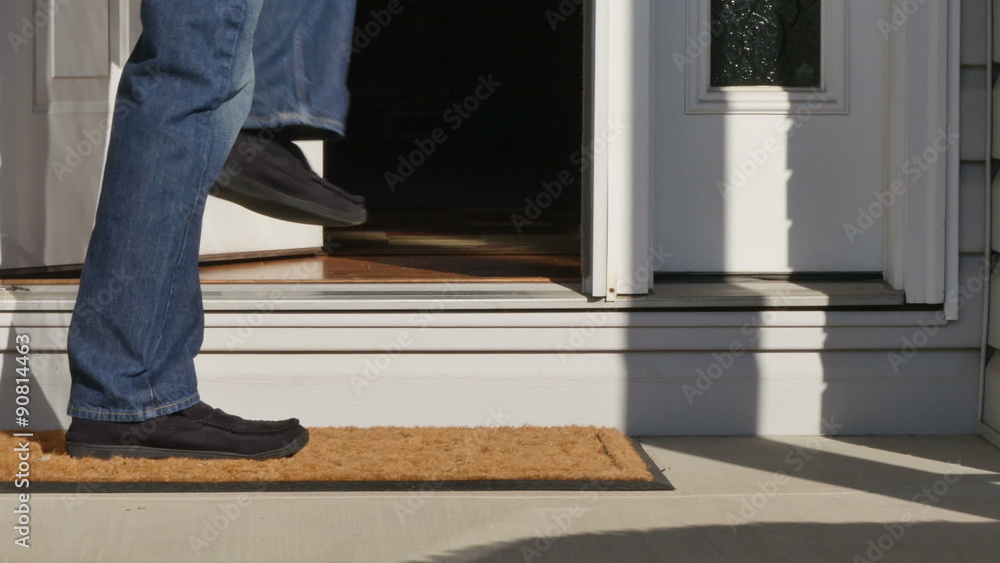 5376 A man picks up a package from outside his front door. 5376 A man picks up a package from outside his front door.