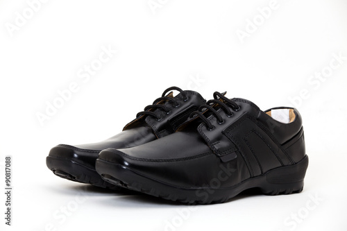a pair of black leather shoes for men isolated on white available with clipping path