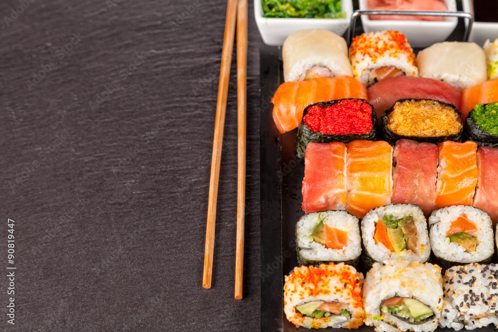 sushi pieces with chopsticks sushi pieces with chopsticks