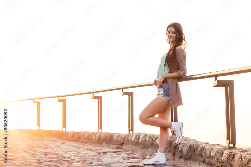 beautiful girl on the background of old houses beautiful girl on the background of old houses