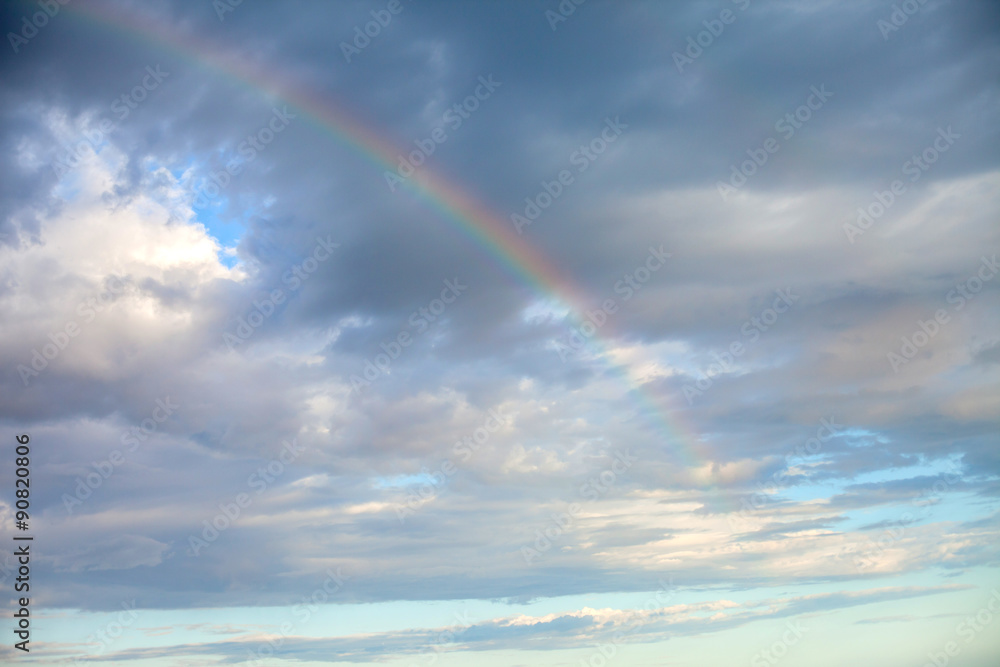 Rainbow in a blue sky, summertime