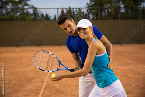 Couple playing in tennis © Drobot Dean