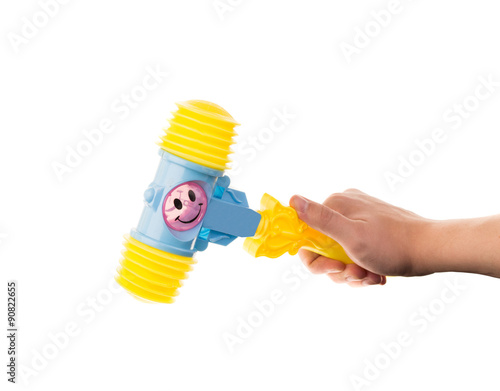 child's toy hammer in hand 