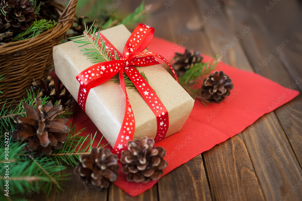 Christmas gifts and cones and on a wooden table Christmas gifts and cones and on a wooden table