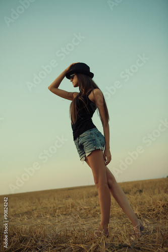 beautiful hipster girl in a field