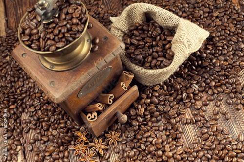 Old coffee grinder and coffee beans